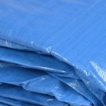 Rolled blue heavy duty tarps
